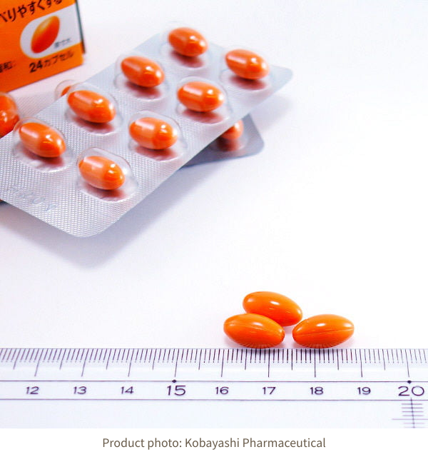 Orange OilDell capsules in blister packaging and beside a ruler; photograph is not life-size on screen